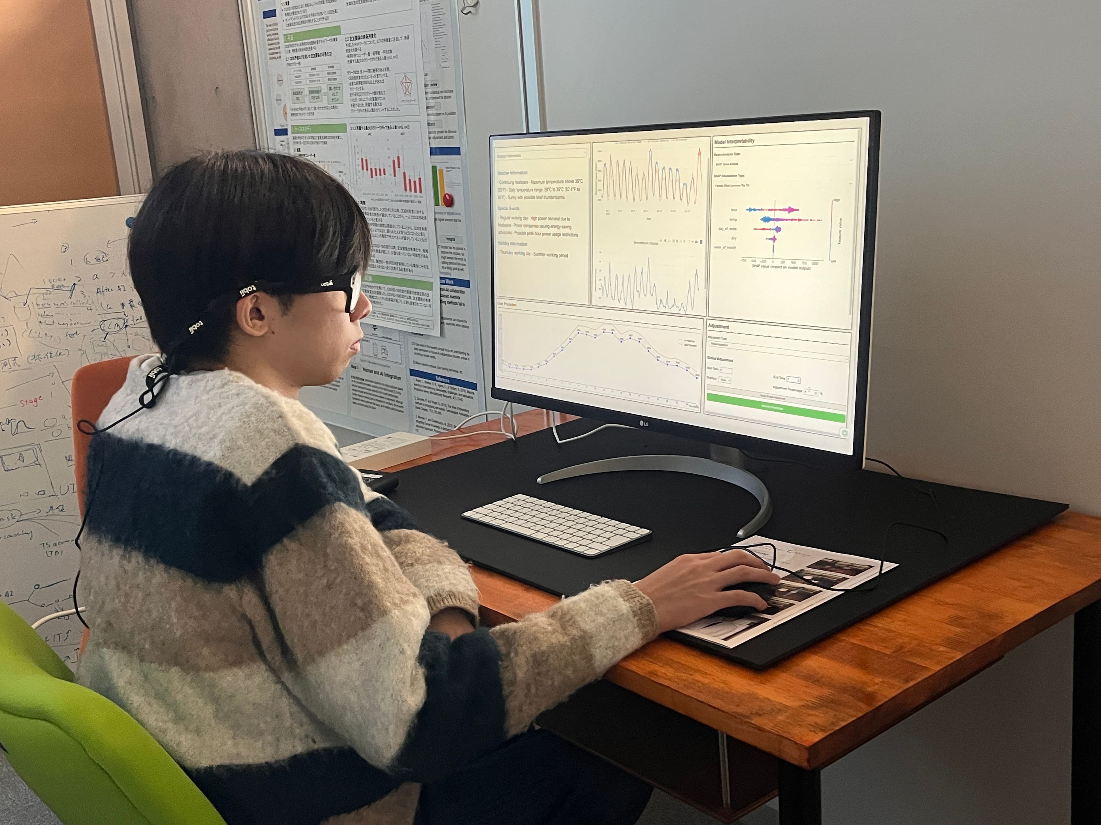 Yichuan wearing eye-tracking glasses, interacting with a Human-AI electricity-demand forecasting interface (SHAP interpretability + adjustment panel)